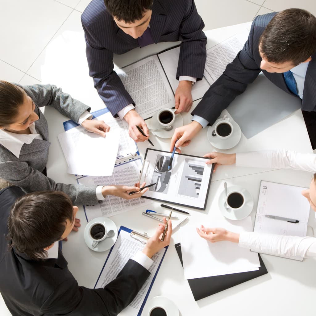 Team collaborating over reports